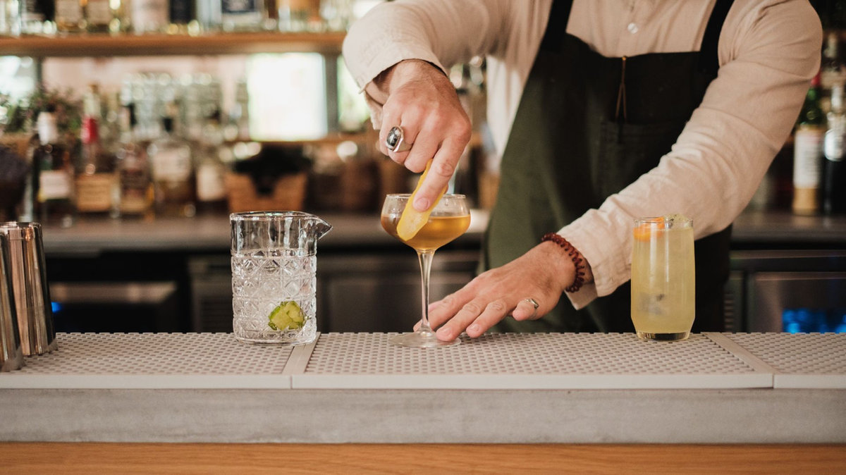 Insured event bartender pouring drinks at a staffed corporate event bar