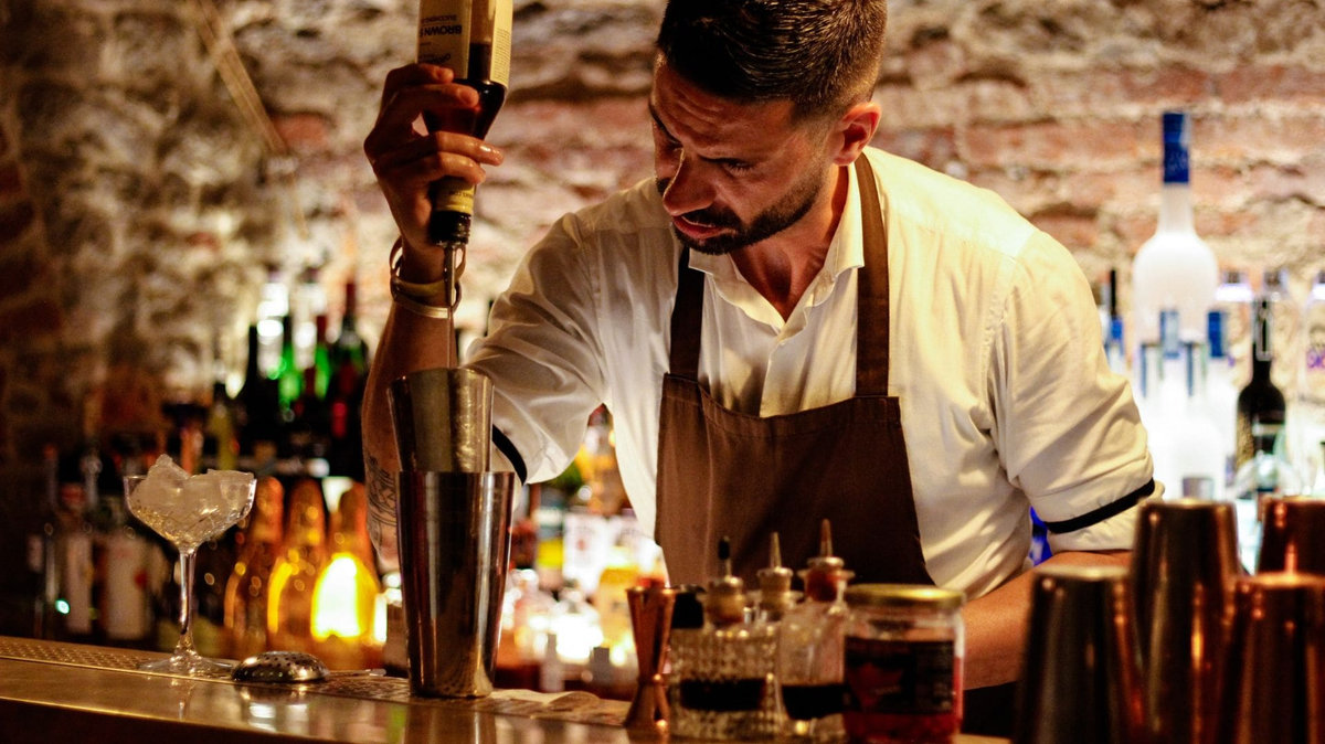 Insured bar service staffed by a bartender serving cocktails to guests