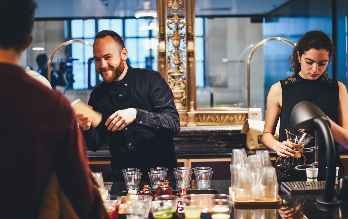 Insured bartender pouring drinks at a staffed holiday event bar