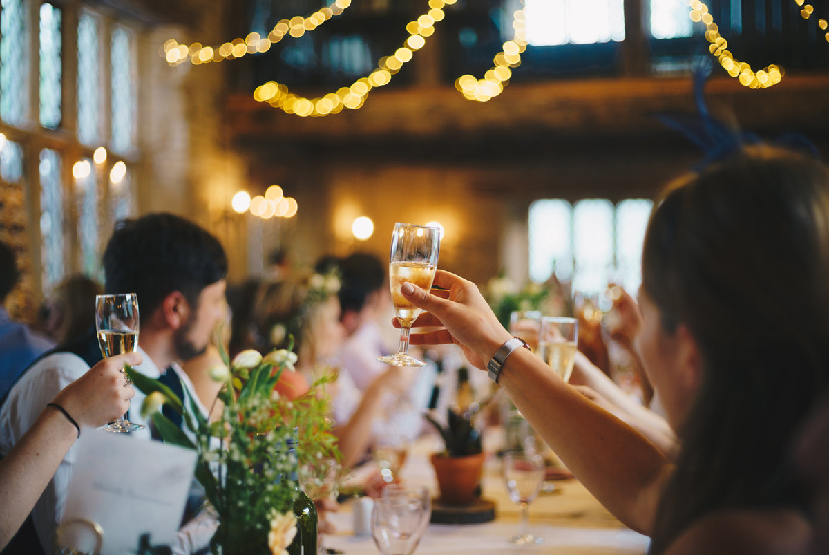 Licensed event bartender serving festive cocktails at a holiday party