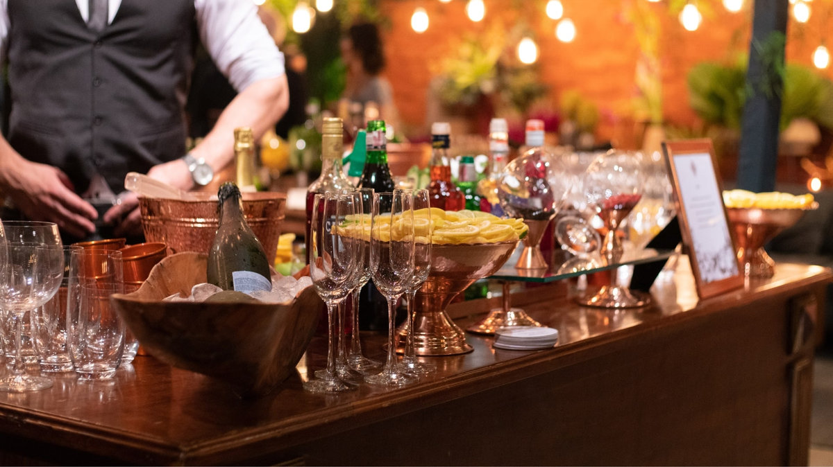 Hire a wedding bartender to serve wine and cocktails at your reception